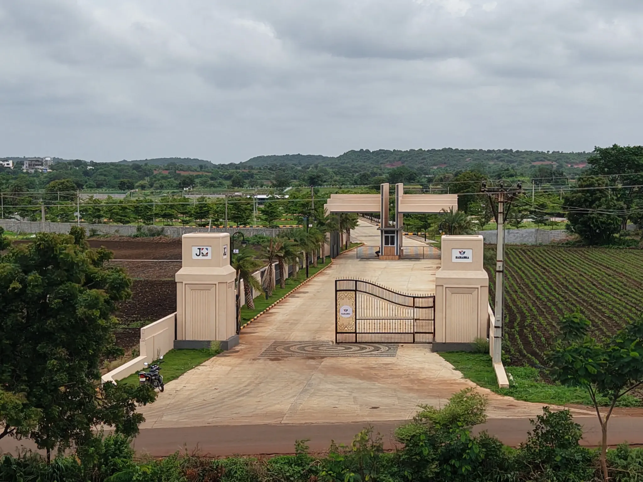 Grand entrance and approach road at Sahasra open plots near Shankarpally