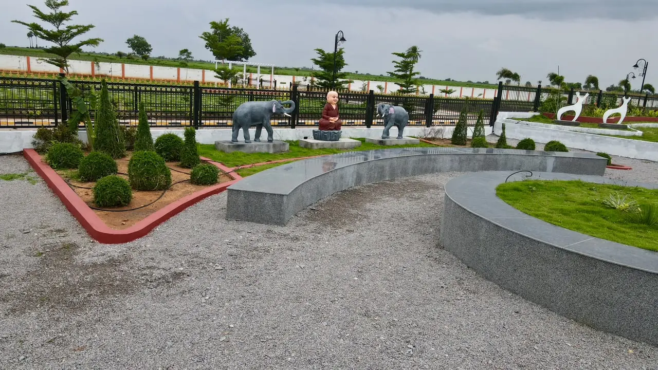 Landscaped community seating area at Subhaga open plot project